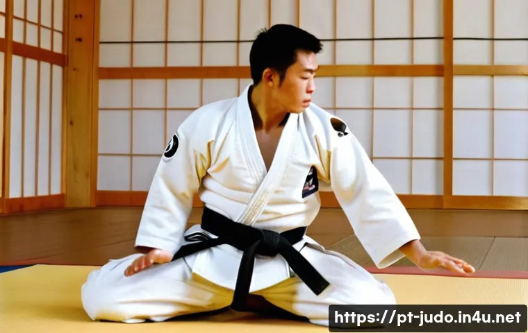 유도와 신체적 균형 - **Judo Ukemi (Falling Technique) in a Traditional Dojo**
    An athletic male judoka, in his late 20...